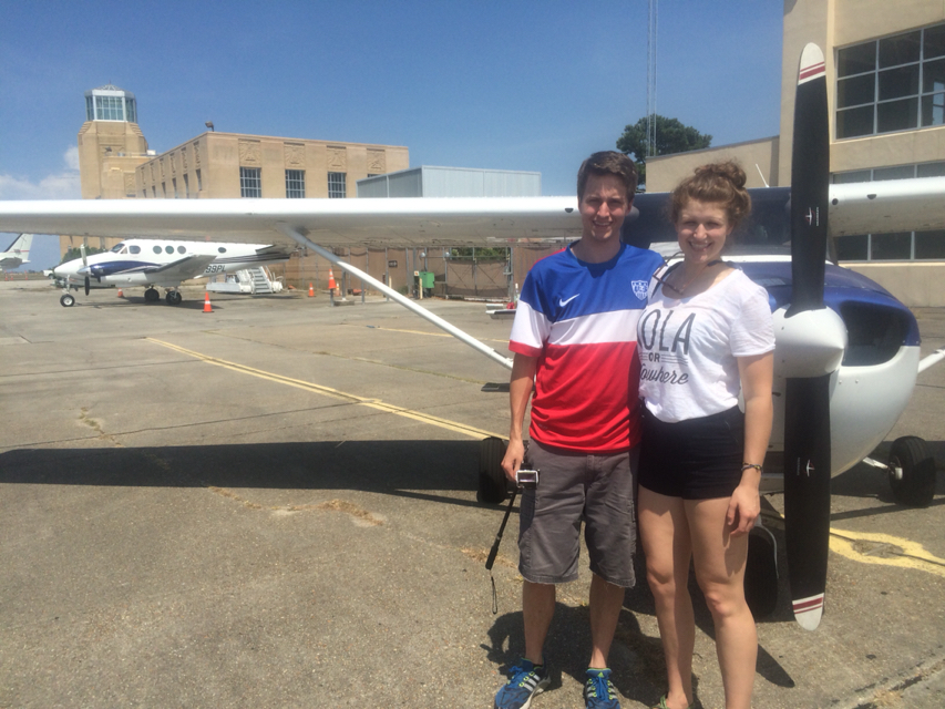 Emily and I standing next to a Fly New Orleans airplane after our flight.